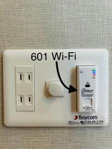 an electrical outlet with a switch on it at DC桜の苑601洋室双人床 in Osaka