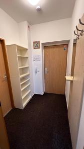 an empty room with a door and a closet at Apartmán Kovárna in Prášily