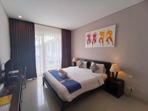 Postel nebo postele na pokoji v ubytování Abian Harmony Hotel
