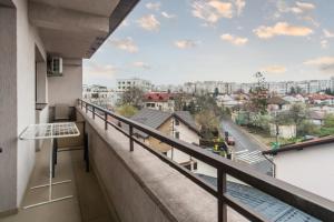 a balcony with a view of a city at Central apartments - Red in Bacău