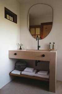 a bathroom with a sink and a mirror at Can Arabí in Ibiza Town