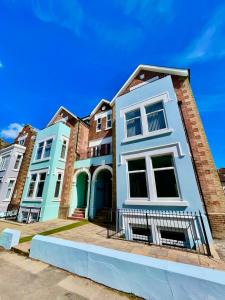 a row of houses on a street at Sea Breeze - Coast in Bournemouth