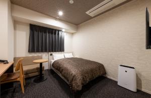 Postel nebo postele na pokoji v ubytování Hotel Legit