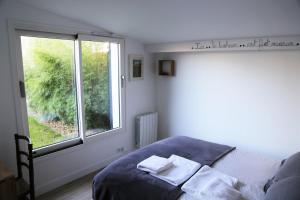 Posteľ alebo postele v izbe v ubytovaní Chambre d'Hôtes Les Petits Oiseaux