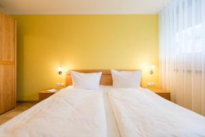Ein Bett oder Betten in einem Zimmer der Unterkunft Quartier 47, App. 07