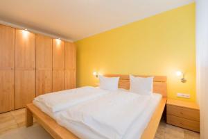 Ein Bett oder Betten in einem Zimmer der Unterkunft Quartier 47, App. 07
