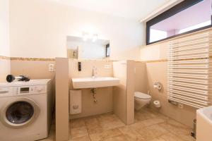 Ein Badezimmer in der Unterkunft Quartier 47, App. 07