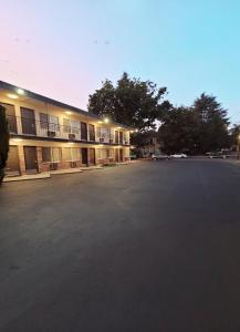 an empty parking lot in front of a building at Executive Lodge in Portland