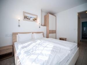 Postel nebo postele na pokoji v ubytování Seeresidenz Haus Baltic, App A02