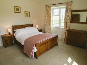 a bedroom with a bed and a window at Armswell House in Ansty