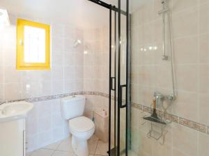 a bathroom with a toilet and a sink and a shower at Villa Gruissan, 3 pièces, 6 personnes - FR-1-409A-20 in Gruissan