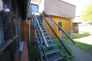 a set of stairs next to a house at Haus 1795 Specht in Wustrow