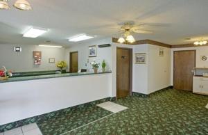 a large room with a bar in the middle at Americas Best Value Inn West Frankfort in West Frankfort