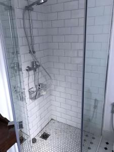 a bathroom with a shower with a glass door at Villa Eugenia in La Herradura