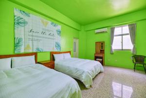 Llit o llits en una habitació de Chunfa B&B