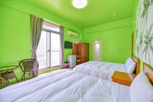 Llit o llits en una habitació de Chunfa B&B