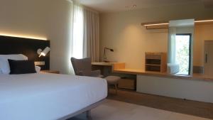Posteľ alebo postele v izbe v ubytovaní Hotel El Molí