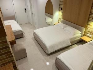 Postel nebo postele na pokoji v ubytování Hotel Piccolino