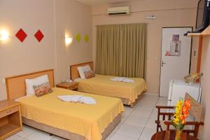 Katil atau katil-katil dalam bilik di Arthur Palace Hotel