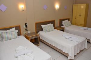 Katil atau katil-katil dalam bilik di Arthur Palace Hotel