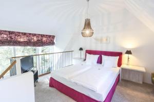 Postel nebo postele na pokoji v ubytování Landhaus am See