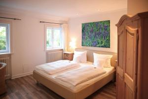 Postel nebo postele na pokoji v ubytování Landhaus am See