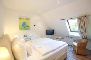 TV a/nebo společenská místnost v ubytování Landhaus am See