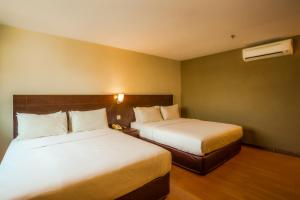 Postel nebo postele na pokoji v ubytování PP Hotel