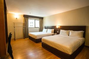 Postel nebo postele na pokoji v ubytování PP Hotel