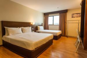 Postel nebo postele na pokoji v ubytování PP Hotel