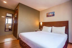 Postel nebo postele na pokoji v ubytování PP Hotel