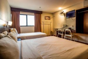 Postel nebo postele na pokoji v ubytování PP Hotel