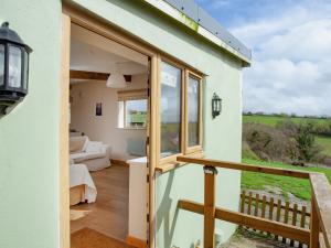 a view of the living room from the balcony of a house at Annies in Bridestowe