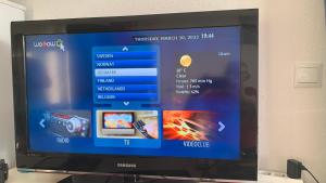 TV a/nebo společenská místnost v ubytování Sunny apartment with 2 terraces