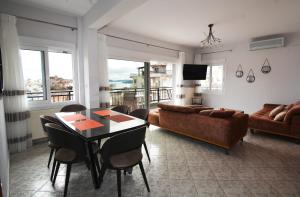 a living room with a couch and a table at Bella Vista in Kavála