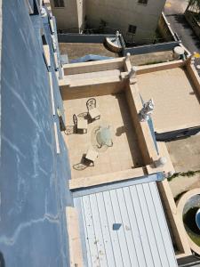 an overhead view of a patio on a building at Villa in village in Dāliyat el Karmil