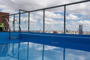 a swimming pool with a view of a city at Campillo 988 in Córdoba