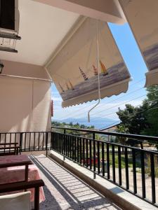 a balcony with a view of the ocean at Villa Vasiliki in Metamorfosi