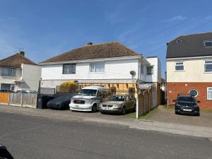 two cars parked in front of a house at Na in Ramsgate