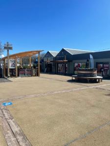 a building with a fountain in the middle of a parking lot at Caravan - Sleeps up to 8 & Free parking in Grange Over Sands