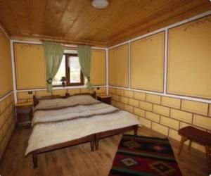 Postel nebo postele na pokoji v ubytování Радкината къща