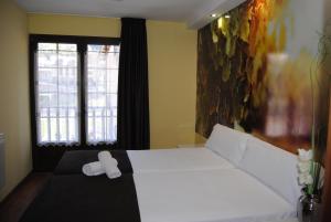 Postel nebo postele na pokoji v ubytování The Way Hotel Molinaseca