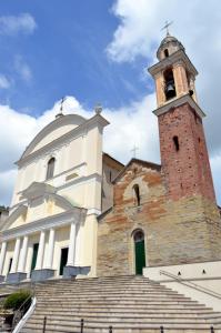 a church with a tower and a building with stairs at Golfo Paradiso Campane di Uscio piccola bomboniera pochi chilometri Camogli Portofino Santamargherita in Uscio