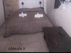 Postel nebo postele na pokoji v ubytování Abbazia Degli Svevi