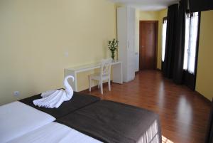 Postel nebo postele na pokoji v ubytování The Way Hotel Molinaseca