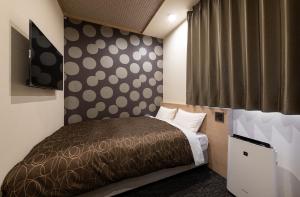 Ένα ή περισσότερα κρεβάτια σε δωμάτιο στο Hotel Legit