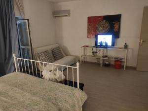 A bed or beds in a room at Terrazza Sui Sassi