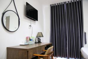 TV a/nebo společenská místnost v ubytování HAPPY HOTEL Tp Rạch Giá, Kiên Giang