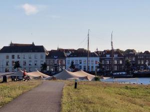 a group of tents in front of a building at 't Hanzehuys in Kampen