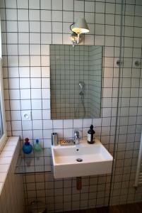 a bathroom with a sink and a mirror at 18 Crebillon in Nantes